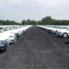 Driveway and Car Park Grid System – Heavy Duty Plastic Ground Reinforcement Cars parked on heavy duty black plastic driveway grids used for car park ground reinforcement