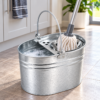 Galvanised Mop Bucket in Use Galvanised metal mop bucket with wringer in use